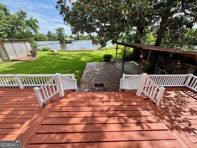198 Swift Creek Rd, Cordele, GA 31015 - wooden terrace featuring a water view and a yard
