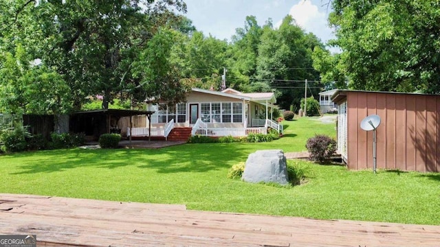 198 Swift Creek Rd, Cordele, GA 31015 - rear view of house with a lawn, a wooden deck, and a porch