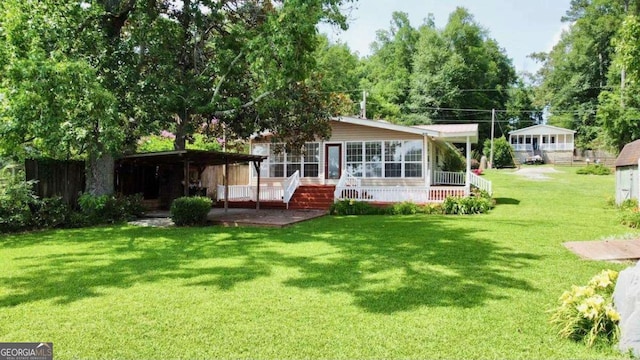 198 Swift Creek Rd, Cordele, GA 31015 - back of house featuring a lawn and a wooden deck