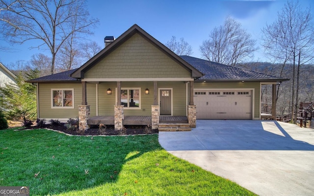 2628 Rolling River Dr, Hiawassee, GA 30546 - craftsman-style house featuring a chimney, concrete driveway, an attached garage, a front lawn, and covered porch