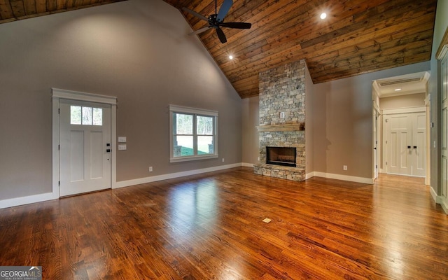 2628 Rolling River Dr, Hiawassee, GA 30546 - unfurnished living room with high vaulted ceiling, a ceiling fan, wooden ceiling, wood finished floors, and a stone fireplace