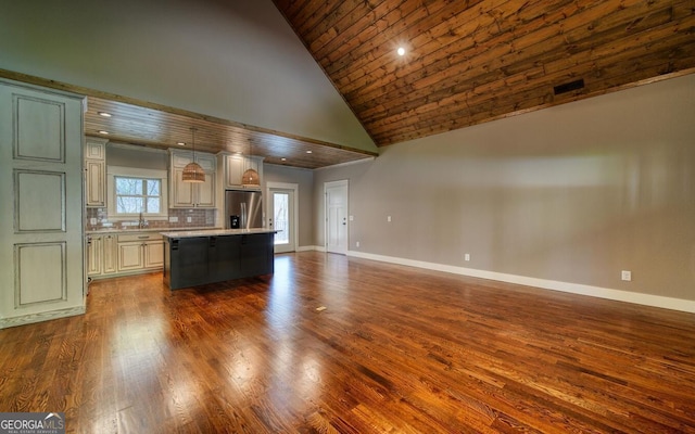 2628 Rolling River Dr, Hiawassee, GA 30546 - kitchen featuring stainless steel fridge, high vaulted ceiling, light countertops, a center island, and open floor plan