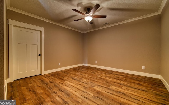 2628 Rolling River Dr, Hiawassee, GA 30546 - unfurnished room with crown molding, hardwood / wood-style floors, a ceiling fan, baseboards, and a textured ceiling