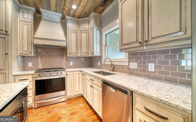 2628 Rolling River Dr, Hiawassee, GA 30546 - kitchen featuring stainless steel appliances, wooden ceiling, a sink, wall chimney range hood, and light wood-style floors