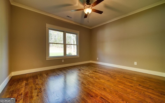 2628 Rolling River Dr, Hiawassee, GA 30546 - empty room featuring crown molding, wood finished floors, ceiling fan, and baseboards