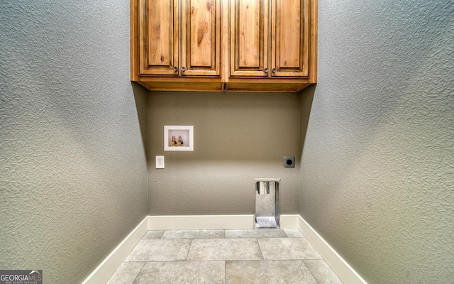 2628 Rolling River Dr, Hiawassee, GA 30546 - washroom with baseboards, washer hookup, electric dryer hookup, cabinet space, and a textured wall