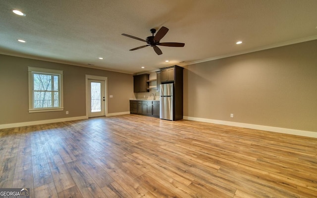 2628 Rolling River Dr, Hiawassee, GA 30546 - unfurnished living room featuring ceiling fan, crown molding, light wood-type flooring, recessed lighting, and baseboards