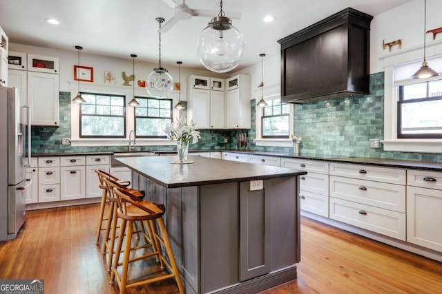 781 Boulevard, Athens, GA 30601 - kitchen with stainless steel refrigerator with ice dispenser, a sink, healthy amount of natural light, tasteful backsplash, and recessed lighting