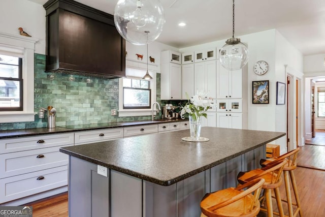 781 Boulevard, Athens, GA 30601 - kitchen with dark countertops, a sink, a center island, tasteful backsplash, and recessed lighting
