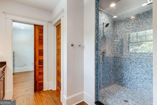 781 Boulevard, Athens, GA 30601 - bathroom with a shower stall, wood finished floors, vanity, recessed lighting, and baseboards