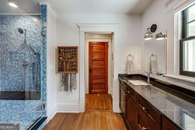 781 Boulevard, Athens, GA 30601 - bathroom featuring a shower stall, wood finished floors, vanity, and healthy amount of natural light