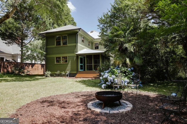 781 Boulevard, Athens, GA 30601 - rear view of property with an outdoor fire pit and a sunroom