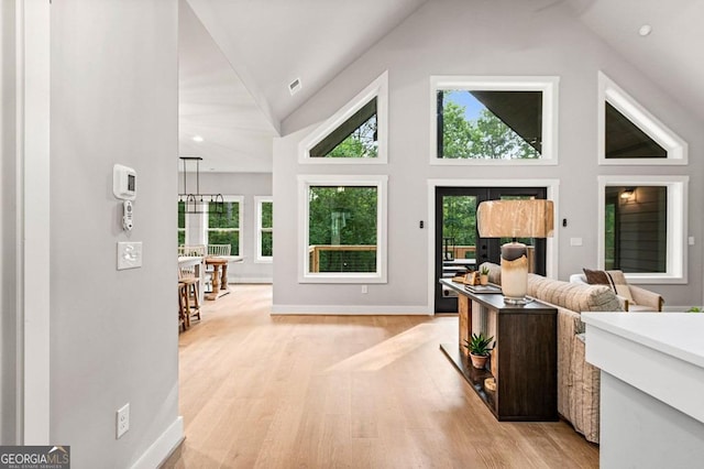 980 Bridge Rd, Ellijay, GA 30540 - living area featuring light wood finished floors, healthy amount of natural light, recessed lighting, and high vaulted ceiling