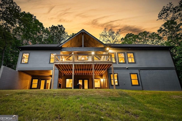 980 Bridge Rd, Ellijay, GA 30540 - back of house at dusk with a yard and a wooden deck