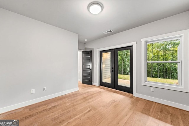 980 Bridge Rd, Ellijay, GA 30540 - empty room featuring french doors and light wood finished floors