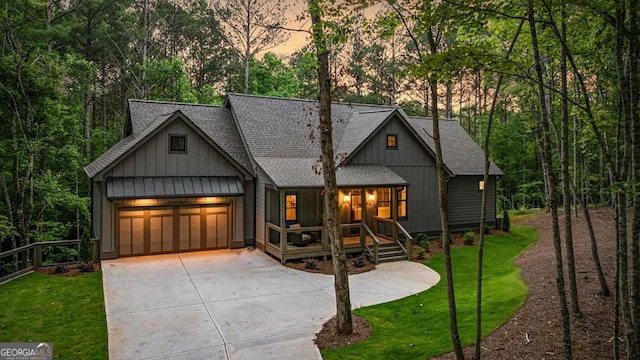 980 Bridge Rd, Ellijay, GA 30540 - rustic home featuring board and batten siding, driveway, a shingled roof, a yard, and a garage
