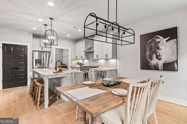 980 Bridge Rd, Ellijay, GA 30540 - dining space with a chandelier, light wood-style flooring, and recessed lighting