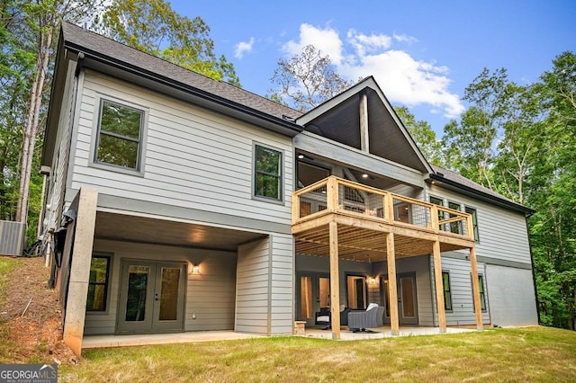 980 Bridge Rd, Ellijay, GA 30540 - back of property featuring french doors, a patio area, and a lawn