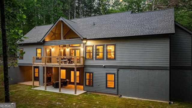 980 Bridge Rd, Ellijay, GA 30540 - back of property with a patio area, a lawn, and roof with shingles