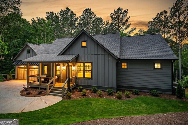 980 Bridge Rd, Ellijay, GA 30540 - modern inspired farmhouse with a shingled roof, a porch, board and batten siding, and driveway