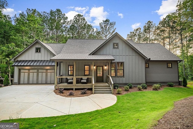 980 Bridge Rd, Ellijay, GA 30540 - modern inspired farmhouse featuring covered porch, a shingled roof, board and batten siding, and driveway