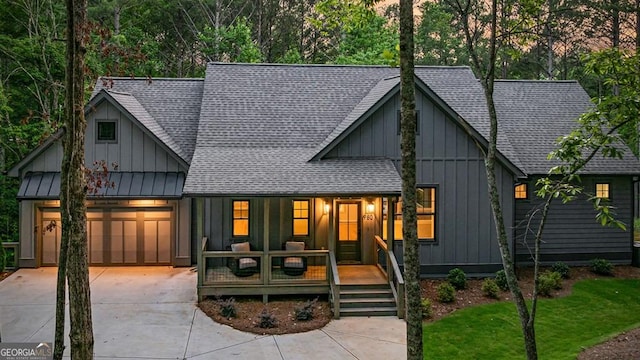 980 Bridge Rd, Ellijay, GA 30540 - modern farmhouse style home featuring board and batten siding, a shingled roof, a garage, and driveway