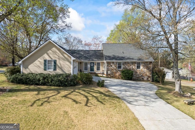 2019 Wiltshire Pl, Snellville, GA 30078 - view of front of house featuring driveway, a front yard, and stone siding