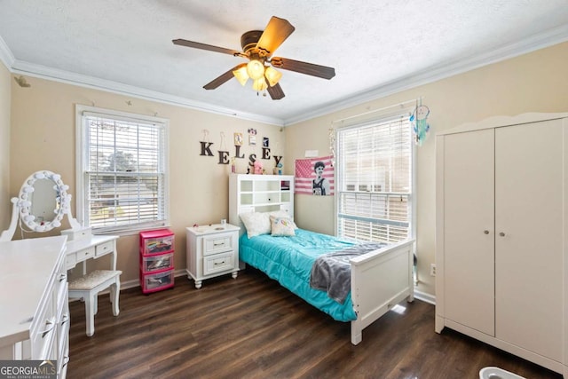 2019 Wiltshire Pl, Snellville, GA 30078 - bedroom featuring dark wood-type flooring, ornamental molding, ceiling fan, and a textured ceiling