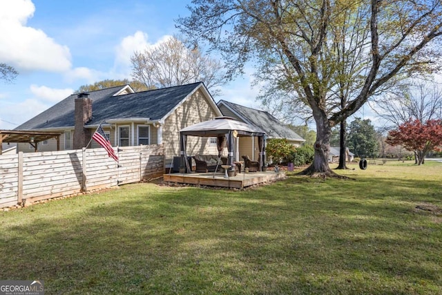 2019 Wiltshire Pl, Snellville, GA 30078 - rear view of house with a gazebo, a wooden deck, and a chimney