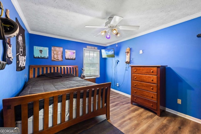 2019 Wiltshire Pl, Snellville, GA 30078 - bedroom featuring a textured ceiling, wood finished floors, ceiling fan, and crown molding