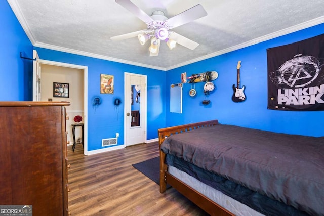 2019 Wiltshire Pl, Snellville, GA 30078 - bedroom featuring wood finished floors, ceiling fan, a textured ceiling, and crown molding