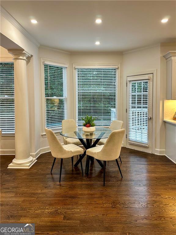365 Morning Dew Cir, Roswell, GA 30075 - dining area featuring decorative columns, crown molding, dark wood-style floors, recessed lighting, and baseboards