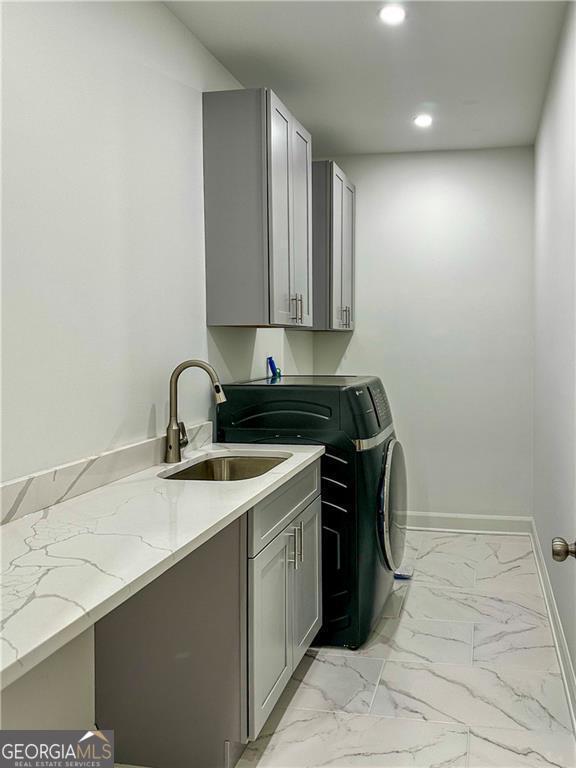 365 Morning Dew Cir, Roswell, GA 30075 - laundry area with recessed lighting, light marble finish flooring, washer / dryer, cabinet space, and baseboards