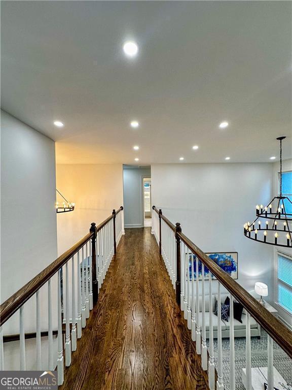 365 Morning Dew Cir, Roswell, GA 30075 - hallway with wood finished floors, a chandelier, recessed lighting, and baseboards