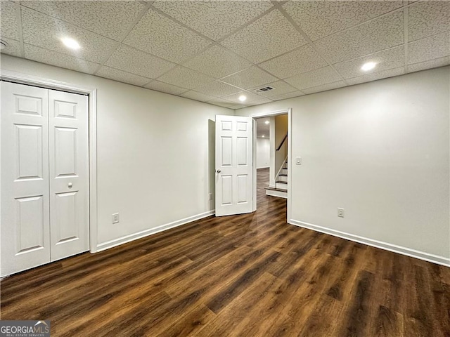 365 Morning Dew Cir, Roswell, GA 30075 - below grade area with a paneled ceiling, dark wood-style flooring, baseboards, stairway, and recessed lighting