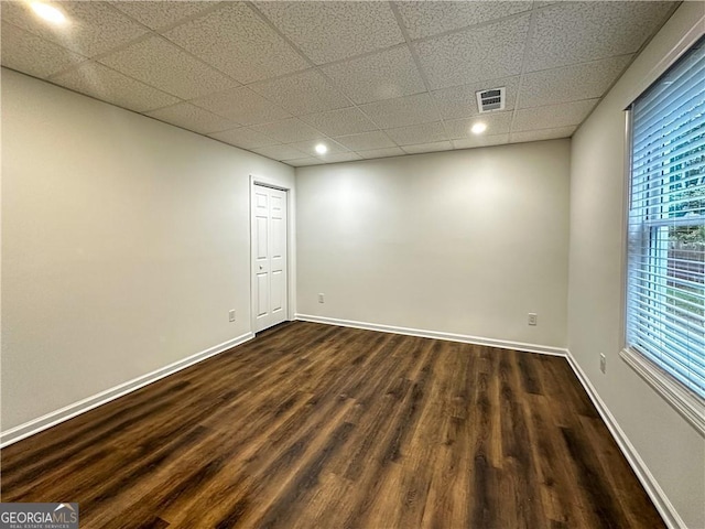 365 Morning Dew Cir, Roswell, GA 30075 - empty room with dark wood-type flooring, a paneled ceiling, baseboards, and recessed lighting