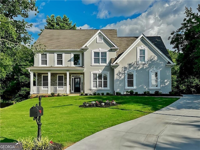 365 Morning Dew Cir, Roswell, GA 30075 - traditional-style house featuring covered porch, stucco siding, a front yard, and a shingled roof