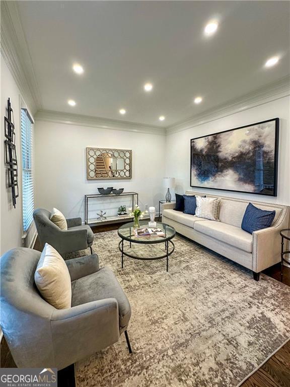 365 Morning Dew Cir, Roswell, GA 30075 - living room with wood finished floors, ornamental molding, and recessed lighting
