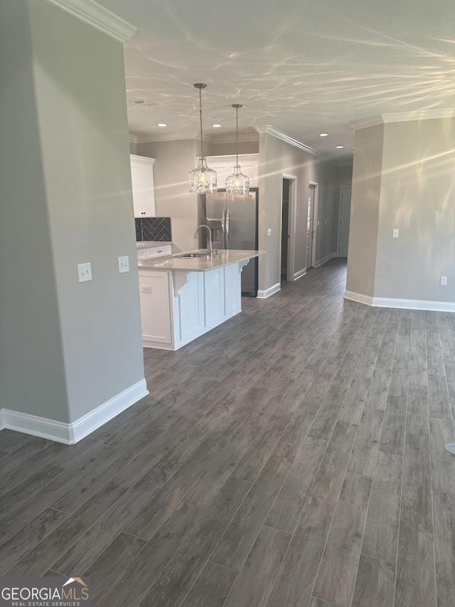 223 Ryan Nicholas Dr, Kingsland, GA 31548 - kitchen with open floor plan, crown molding, stainless steel fridge with ice dispenser, dark wood-style flooring, and recessed lighting