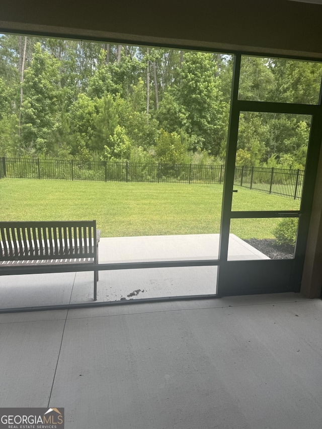 223 Ryan Nicholas Dr, Kingsland, GA 31548 - unfurnished sunroom with view of scattered trees