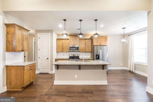 213 Barnyard Way, Perry, GA 31069 - kitchen featuring appliances with stainless steel finishes, a sink, tasteful backsplash, dark wood-style floors, and recessed lighting