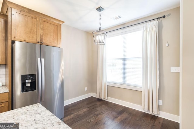 213 Barnyard Way, Perry, GA 31069 - kitchen featuring stainless steel fridge with ice dispenser, dark wood finished floors, a chandelier, baseboards, and pendant lighting