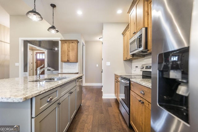 213 Barnyard Way, Perry, GA 31069 - kitchen with stainless steel appliances, a sink, decorative backsplash, light stone counters, and dark wood-style flooring