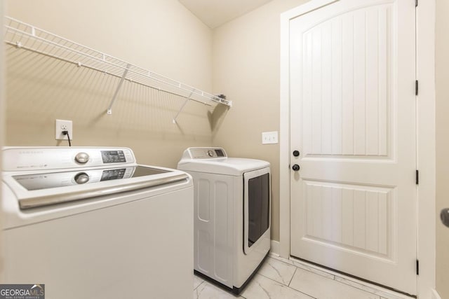 213 Barnyard Way, Perry, GA 31069 - laundry area with washing machine and dryer and light marble finish flooring