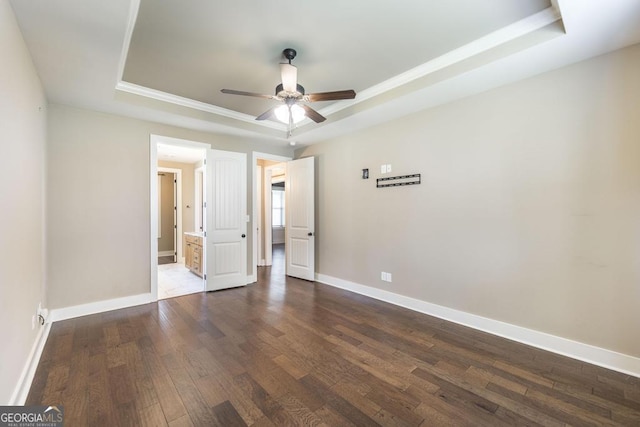 213 Barnyard Way, Perry, GA 31069 - unfurnished bedroom featuring a raised ceiling, hardwood / wood-style flooring, baseboards, crown molding, and ensuite bath