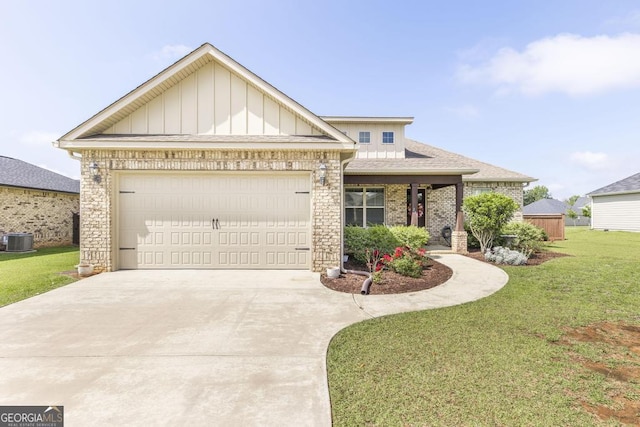 213 Barnyard Way, Perry, GA 31069 - view of front of house featuring central AC unit, a front lawn, concrete driveway, a garage, and board and batten siding