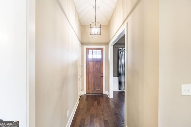 213 Barnyard Way, Perry, GA 31069 - doorway with dark wood finished floors, a chandelier, and baseboards