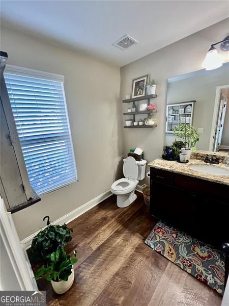 37 Frost Ln, Dawsonville, GA 30534 - bathroom with vanity, toilet, wood finished floors, and baseboards