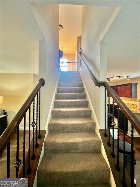 37 Frost Ln, Dawsonville, GA 30534 - stairway featuring baseboards