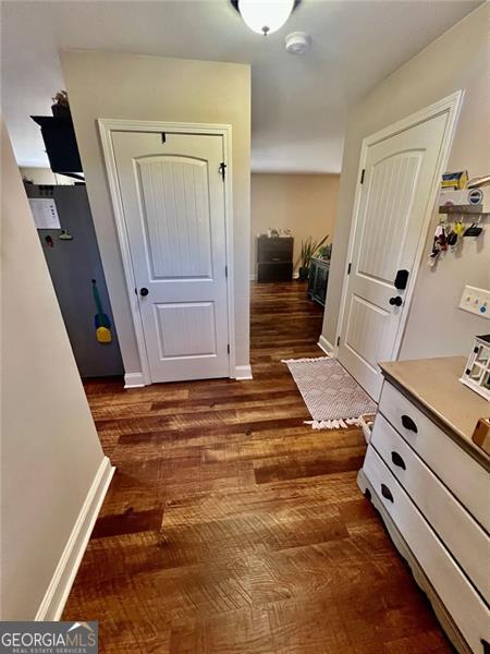 37 Frost Ln, Dawsonville, GA 30534 - hallway featuring dark wood finished floors and baseboards